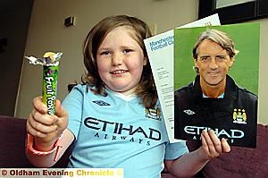A DELIGHTED Megan Kinghorn with her fruit pastilles and signed photo and letter from Roberto Mancini. A DELIGHTED Megan Kinghorn with her fruit pastilles and signed photo and letter from Roberto Mancini.