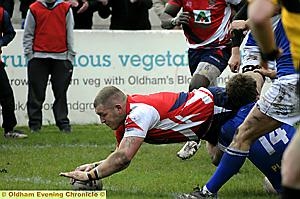 ON THE DIVE: Matthew Fogarty (above) flies over for to register Oldham’s second score of the second half. 