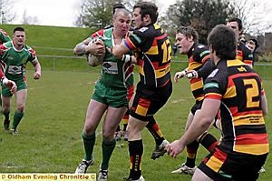 STOP THERE: Craig Highton (left), of Waterhead, is halted by Shaw's Steve Talbot. STOP THERE: Craig Highton (left), of Waterhead, is halted by Shaw's Steve Talbot.