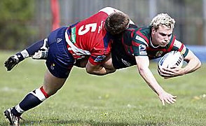Shaun Robinson flies into a tackle to stop Skolars’ John Paxton in his tracks. 