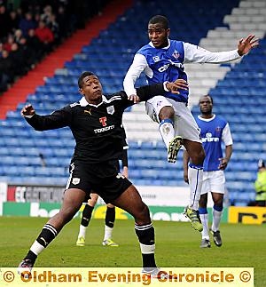 HIGH FLIER: Athletic’s Youssouf Mchangama leaps from the turf in his bid to win possession.  
