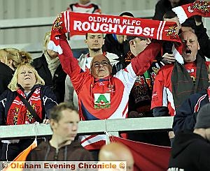 LOUD AND PROUD . . . Oldham fans young and old get behind their team at Langtree Park. 