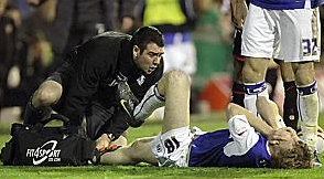 Chris Taylor of Oldham sustains a serious leg injury 
