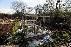 A brand new greenhouse smashed by vandals.