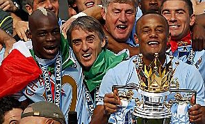 PLENTY TO SMILE ABOUT: boss Roberto Mancini and captain Vincent Kompany celebrate City’s last-gasp glory. PLENTY TO SMILE ABOUT: boss Roberto Mancini and captain Vincent Kompany celebrate City’s last-gasp glory.