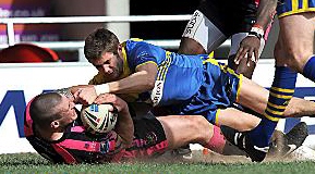 GROUNDED . . . Dave Cookson dives over for Oldham’s third try at the Keepmoat Stadium. 