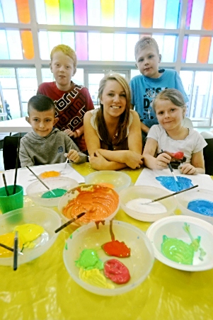 GETTING involved: Chronicle reporter Erin Heywood takes part in arts and crafts activities with Mahdlo members (from left) Callum McCrae, Ben Holmes, Lewis Roberts and Caitlin Stanley 