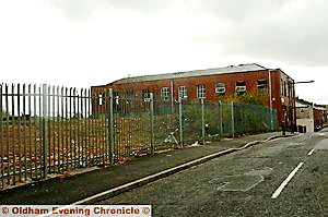 EYESORE . . . the empty site of the former Clarksfield Conservative Club with dilapidated Bank Mill next door 