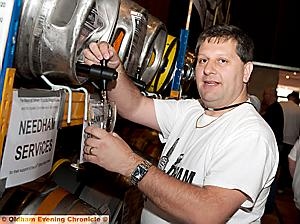 Festival organiser Peter Buckley samples a brew. 