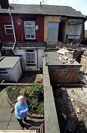 FALLING down: Joan Diggle, of Acre Lane, Derker, next door to the collapsing house. 