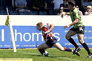 WELL DONE, MATE: John Clough scores Oldham’s second try. 