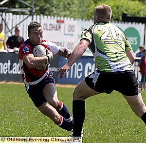 EYE CONTACT: Oldham’s Danny Whitmore attempts to side-step his South Wales Scorpions opponent. 