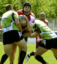 STOP RIGHT THERE . . . Oldham’s Michael Ward sees his path blocked by two South Wales Scorpions players. STOP RIGHT THERE . . . Oldham’s Michael Ward sees his path blocked by two South Wales Scorpions players.