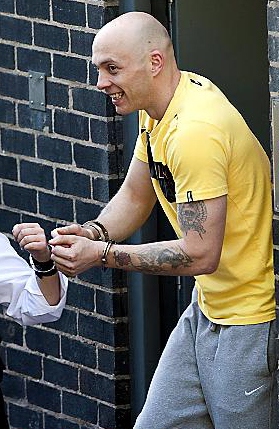 NO remorse: a grinning Robert Hutchinson in handcuffs as he leaves Mold Crown Court after being jailed for 10 years
NO remorse: a grinning Robert Hutchinson in handcuffs as he leaves Mold Crown Court after being jailed for 10 years