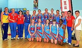 PROUD . . . Asha Francis (left), of Team Bath, is pictured with the players and coaches of Oldham under-14s. PROUD . . . Asha Francis (left), of Team Bath, is pictured with the players and coaches of Oldham under-14s.