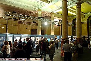 VISITORS flocked to the old town hall to see the plans. 
