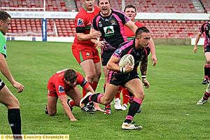 FOUND THE GAP: Danny Whitmore scoots in to score Oldham’s fourth try in the first half. FOUND THE GAP: Danny Whitmore scoots in to score Oldham’s fourth try in the first half.
