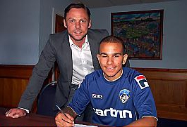 SIGN HERE: new boy Connor Brown completes the formalities with Athletic boss Paul Dickov. SIGN HERE: new boy Connor Brown completes the formalities with Athletic boss Paul Dickov.