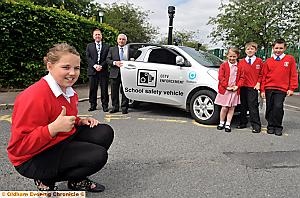 DRIVING FORCE: the new School Safety Vehicle gets the thumbs-up from Casey Devine (front), whose successful campaign led to its introduction DRIVING FORCE: the new School Safety Vehicle gets the thumbs-up from Casey Devine (front), whose successful campaign led to its introduction