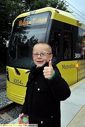 THUMBS UP . . . Kian Sheldon, ready to board the first Metrolink tram to leave Oldham Mumps for Manchester Victoria. THUMBS UP . . . Kian Sheldon, ready to board the first Metrolink tram to leave Oldham Mumps for Manchester Victoria.