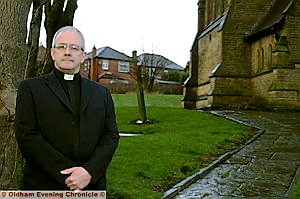 Father Peter McEvitt at Holy Trinity Church, Shaw, where more security measures are to be taken Father Peter McEvitt at Holy Trinity Church, Shaw, where more security measures are to be taken