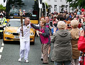 PROUD Failsworth dad Gary Bentley is surrounded by wellwishers. 
