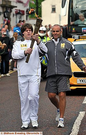 BURSTING with pride . . . Richard Howarth carries the torch  

