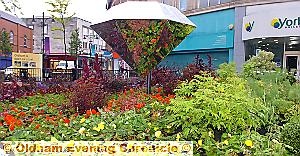 DIAMOND dazzler . . . the flower display and huge glass diamond form the centrepiece of Oldham’s North-West in Bloom entry DIAMOND dazzler . . . the flower display and huge glass diamond form the centrepiece of Oldham’s North-West in Bloom entry