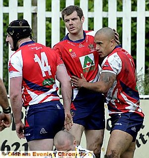 BRIGHT . . . Miles Greenwood (right) receives a pat on the head from John Gillam after scoring Oldham’s only try. BRIGHT . . . Miles Greenwood (right) receives a pat on the head from John Gillam after scoring Oldham’s only try.