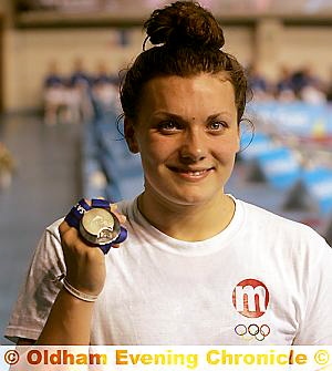 PODIUM FINISH . . . Jessica Lloyd shows off one of her two medals. PODIUM FINISH . . . Jessica Lloyd shows off one of her two medals.