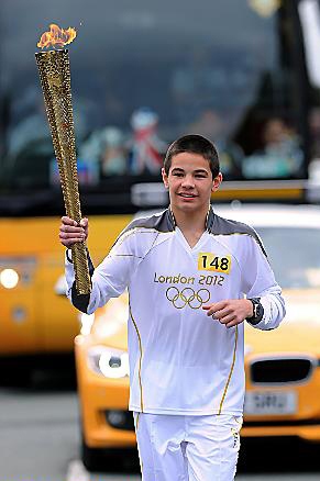 OLYMPIC dream . . . Daniel Panczyszyn carrying the torch  

