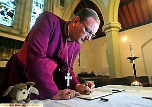 EXPRESSING our grief: the Bishop of Middleton signs the book of condolence at East Crompton St James Church
EXPRESSING our grief: the Bishop of Middleton signs the book of condolence at East Crompton St James Church