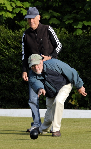 WATCHING OVER YOU . . . Len Kewley looks on as Alan Taylor sends down a bowl in the qualifier at Moorside. 
