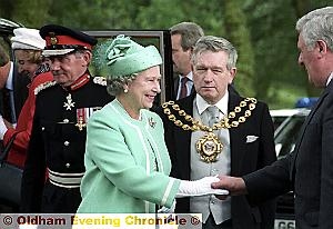 THE Queen visits Alexandra Park, Oldham on July 18, 1992 and is greeted (above) by the Mayor Cllr Norman Bennett and Colin Smith (chief executive of OMBC) before going on walkabout (below).
THE Queen visits Alexandra Park, Oldham on July 18, 1992 and is greeted (above) by the Mayor Cllr Norman Bennett and Colin Smith (chief executive of OMBC) before going on walkabout (below).