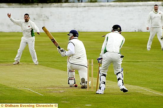 Glodwick’s Imran Khan celebrates after bowling Friarmere batsman Andy Walker. Glodwick’s Imran Khan celebrates after bowling Friarmere batsman Andy Walker.