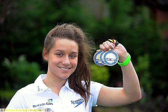 THREE is the magic number: Jessica Fullalove shows off her medals. 