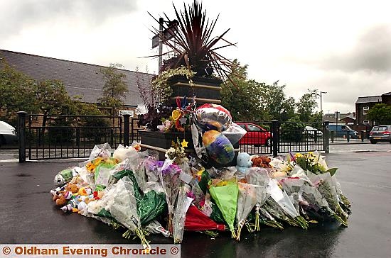 Floral tributes near the scene of the Shaw blast  

