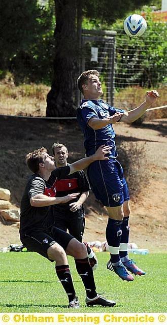 Athletic striker Matt Smith flicks the ball on. Athletic striker Matt Smith flicks the ball on.