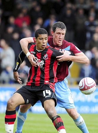 NO-NONSENSE DEFENDING . . . Cliff Byrne gets to grips with an opposition striker.
NO-NONSENSE DEFENDING . . . Cliff Byrne gets to grips with an opposition striker.