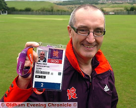 READY FOR ACTION: Steve Grice shows off his pass for the Olympics soccer. READY FOR ACTION: Steve Grice shows off his pass for the Olympics soccer.