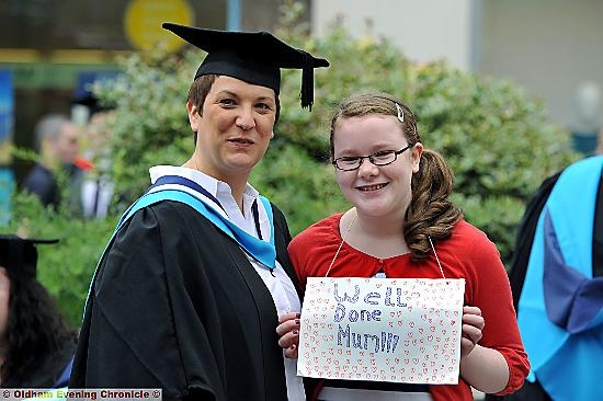 WELL done mum: Erin Maughan displays her pride at her mum Tracey’s achievement 

