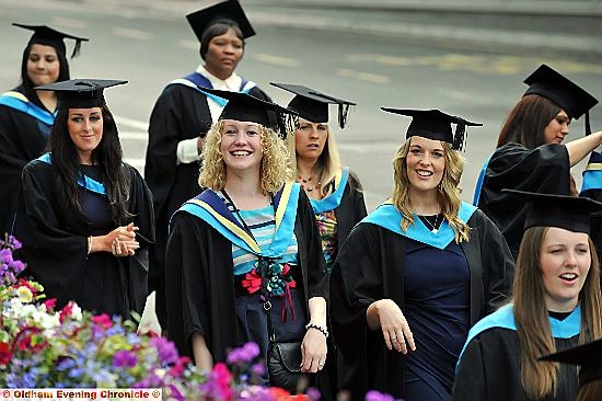 HERE come the girls: students in the graduation parade  

