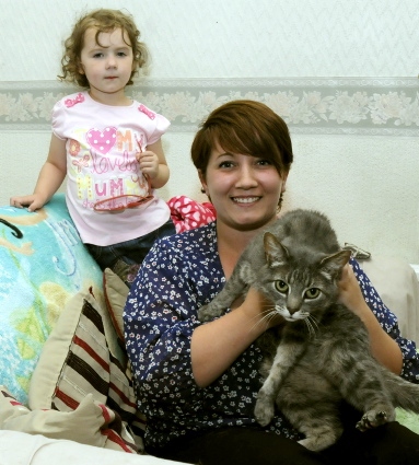 Happy to be back home . . . Sam Perry, with daughter Amelia and cat Asbo
Happy to be back home . . . Sam Perry, with daughter Amelia and cat Asbo