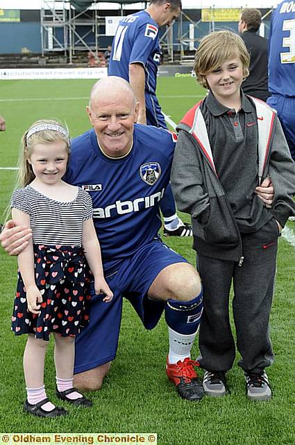 BRAVE: Andy Ritchie with Jack and Jodie Heaton, brother and sister of Jamie Heaton, who led the teams on to the pitch. 
