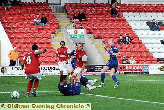AND THAT MAKES THREE: Robbie Simpson slots the ball home. AND THAT MAKES THREE: Robbie Simpson slots the ball home.
