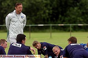 HERE WE ARE AGAIN: Athletic boss Paul Dickov casts his eyes over the squad on the first day of training. 