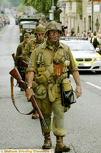 ALL kitted out . . . uniformed soldiers 
