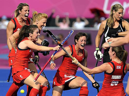 Great Britain - including blonde Nicola on the left – celebrate a goal during the bronze medal play-off. 