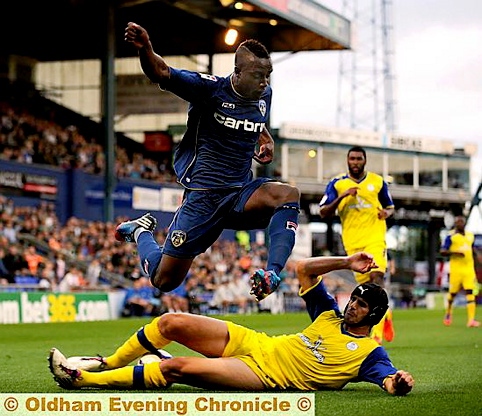 Athletic new boy Jordan Slew is stopped in his tracks by Sheffield Wednesday’s Miguel Lleera.