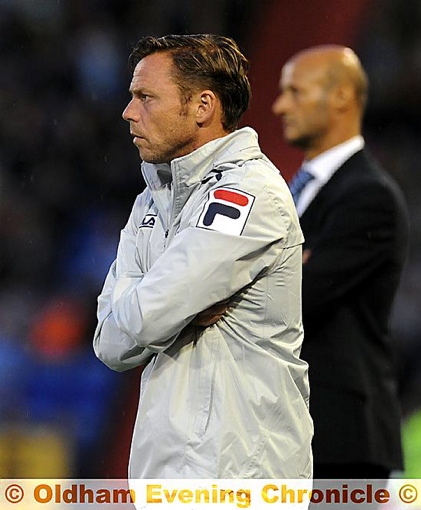 Paul Dickov watches his Athletic side beat Manchester City last night. Paul Dickov watches his Athletic side beat Manchester City last night.
